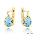 Kolczyki złote z kolekcji "COLORFUL STONE" z eleganckim zapięciem - topaz owal 585 Shelbi Kolczyki złote z kolekcji "COLORFUL STONE" z eleganckim zapięciem - topaz owal 585 Shelbi